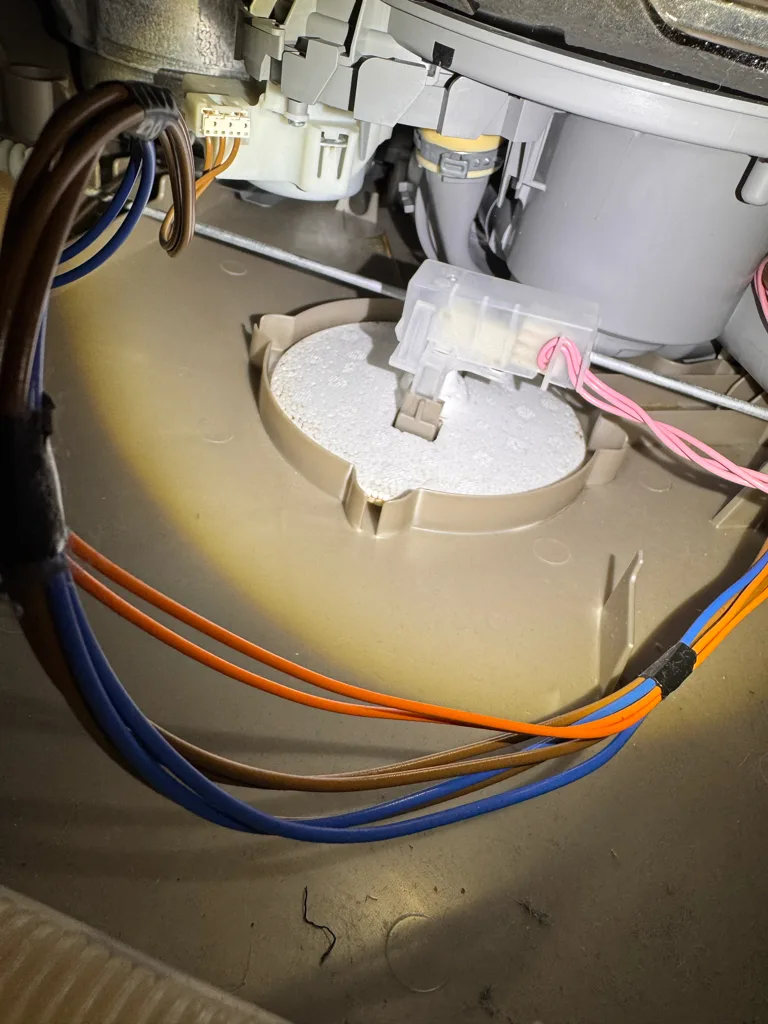Base pan and float switch under a Bosch dishwasher