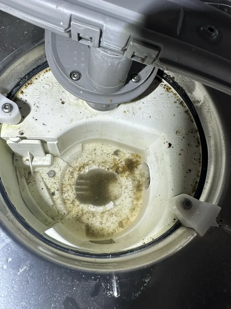 Debris in the sump of a Bosch dishwasher that would not drain