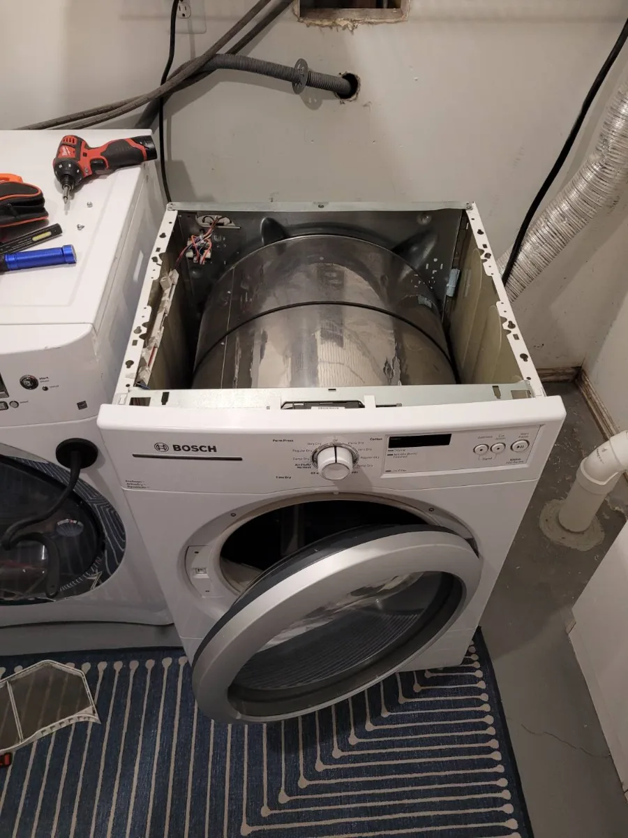 Bosch dryer with the top off during a no-heat repair