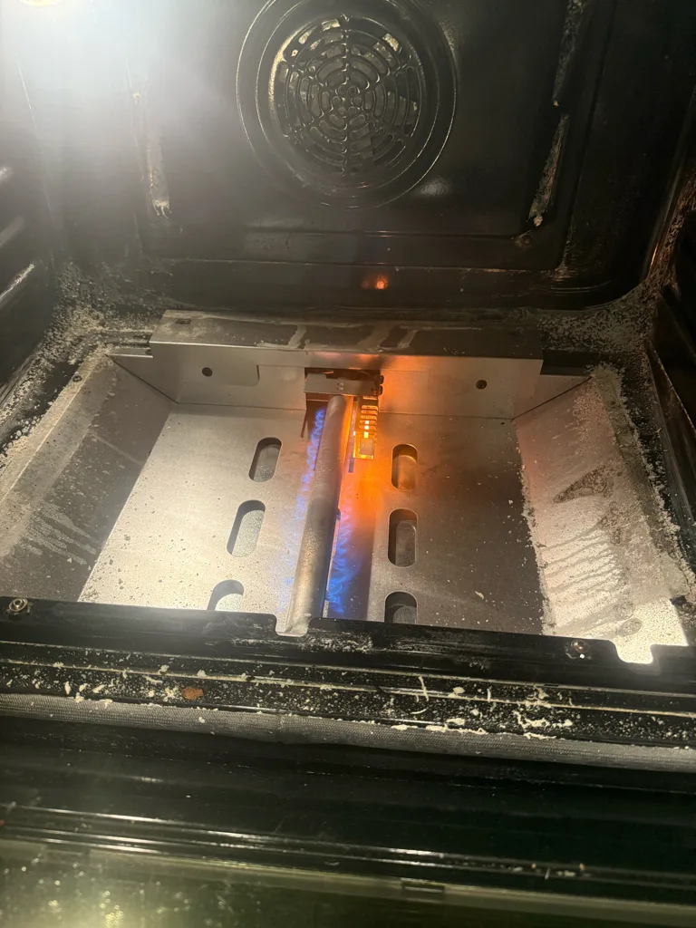 Bake burner lit inside a Bosch gas oven