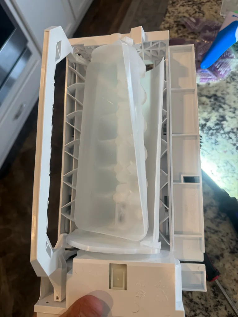 Ice maker assembly removed from a Bosch refrigerator
