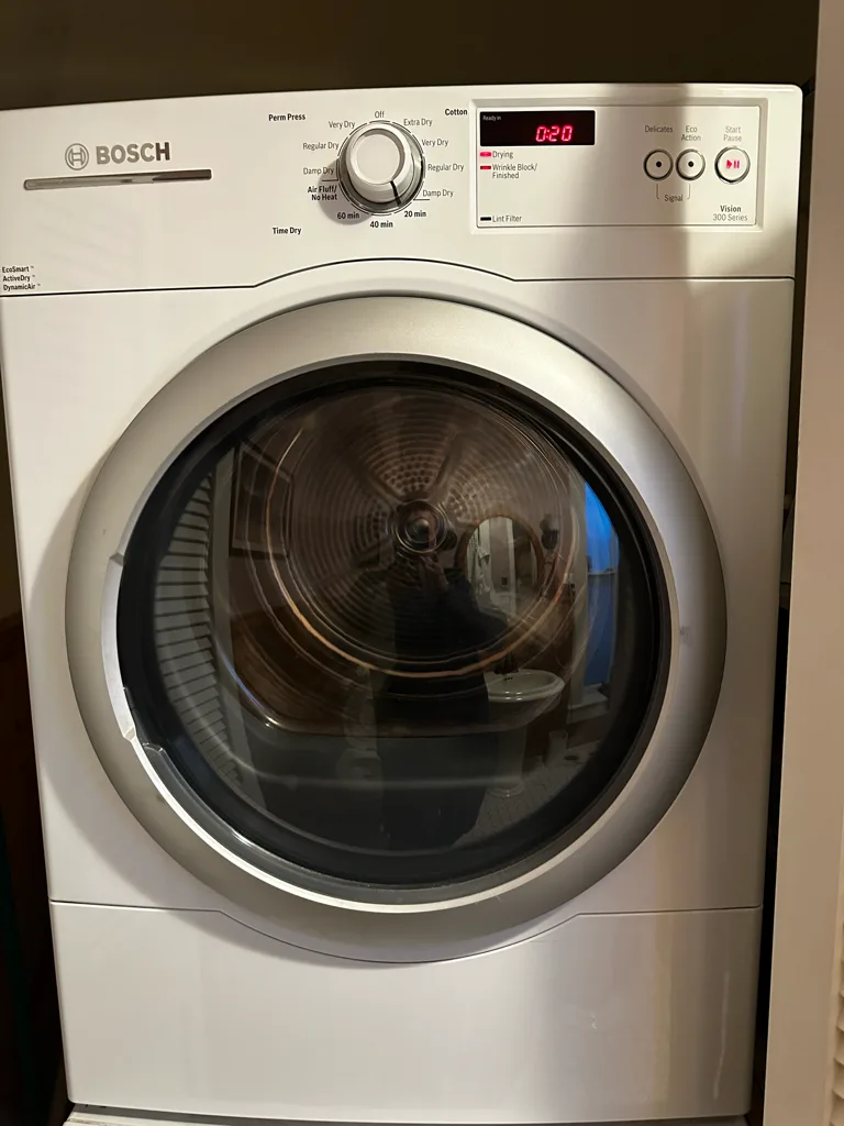White Bosch front-load washer in a Denver-area laundry room