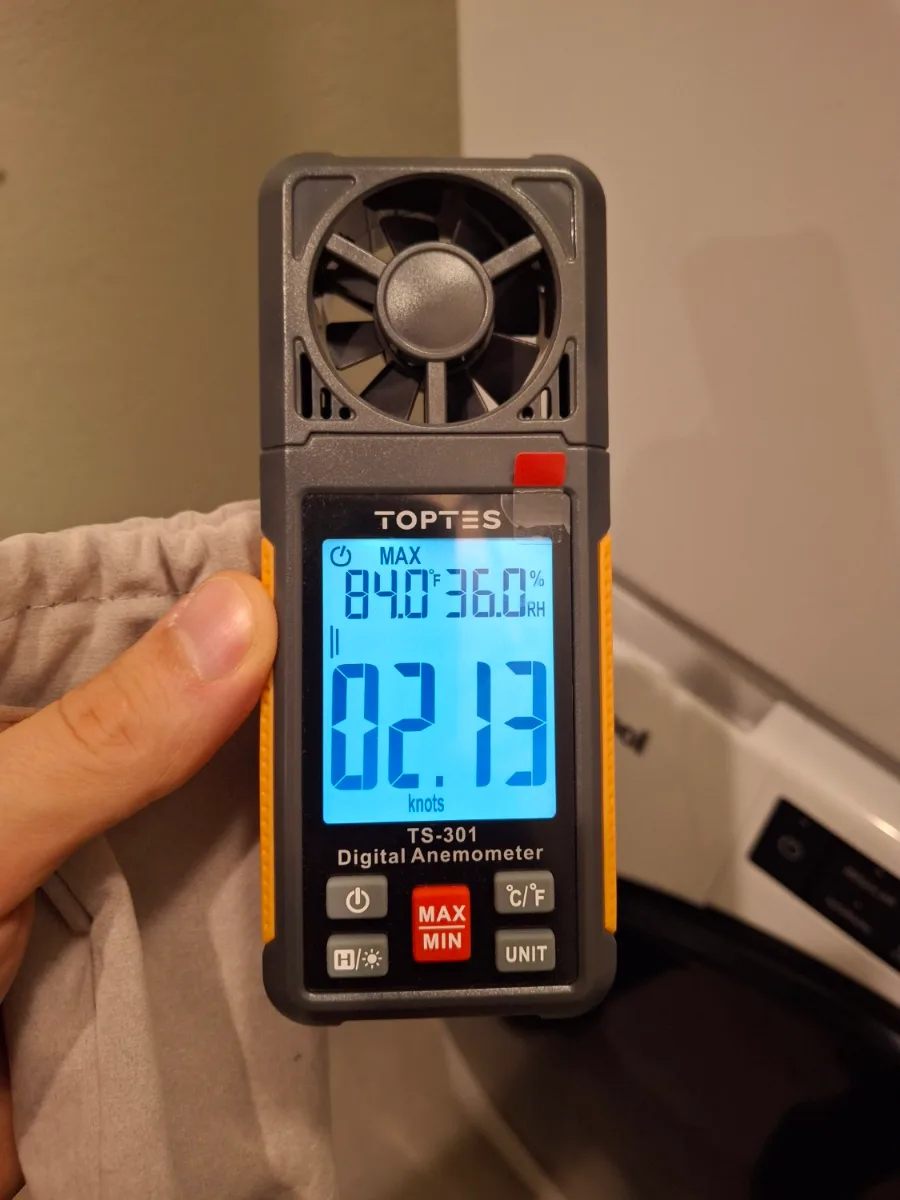 Digital anemometer measuring airflow at a dryer vent
