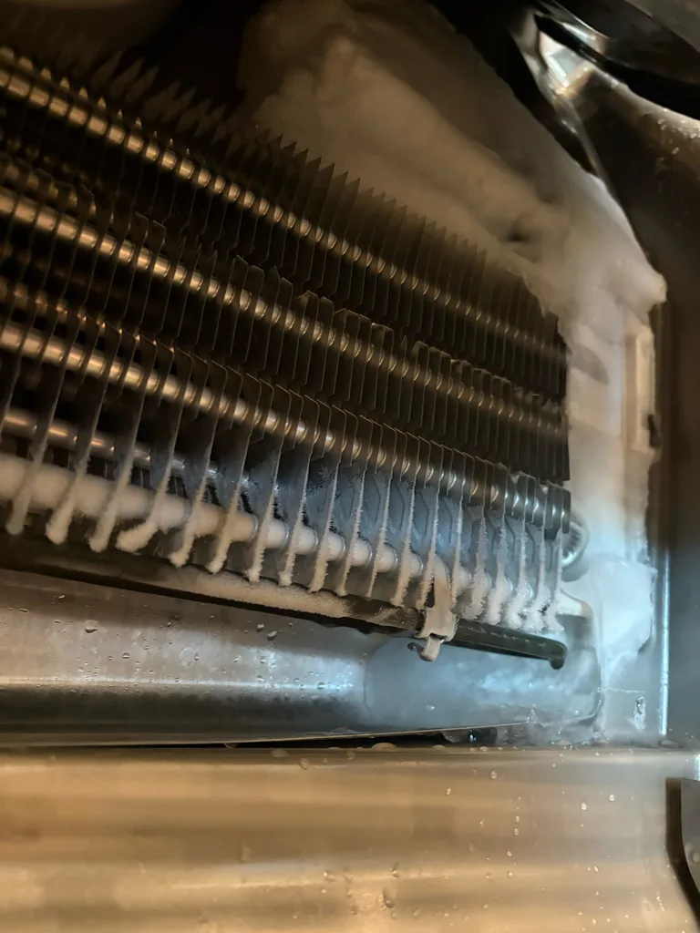 Ice built up on the evaporator of an Electrolux refrigerator