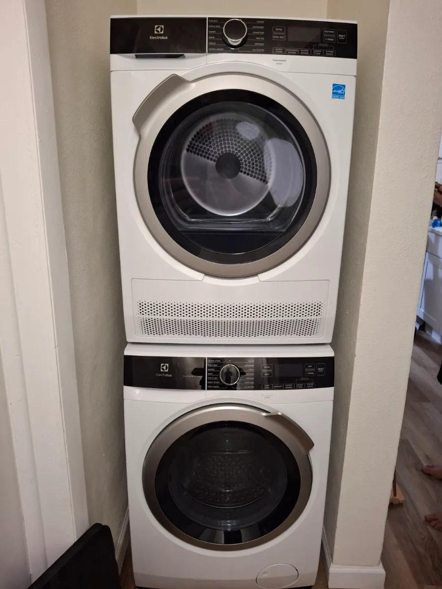 Stacked Electrolux compact washer and ventless dryer in a closet