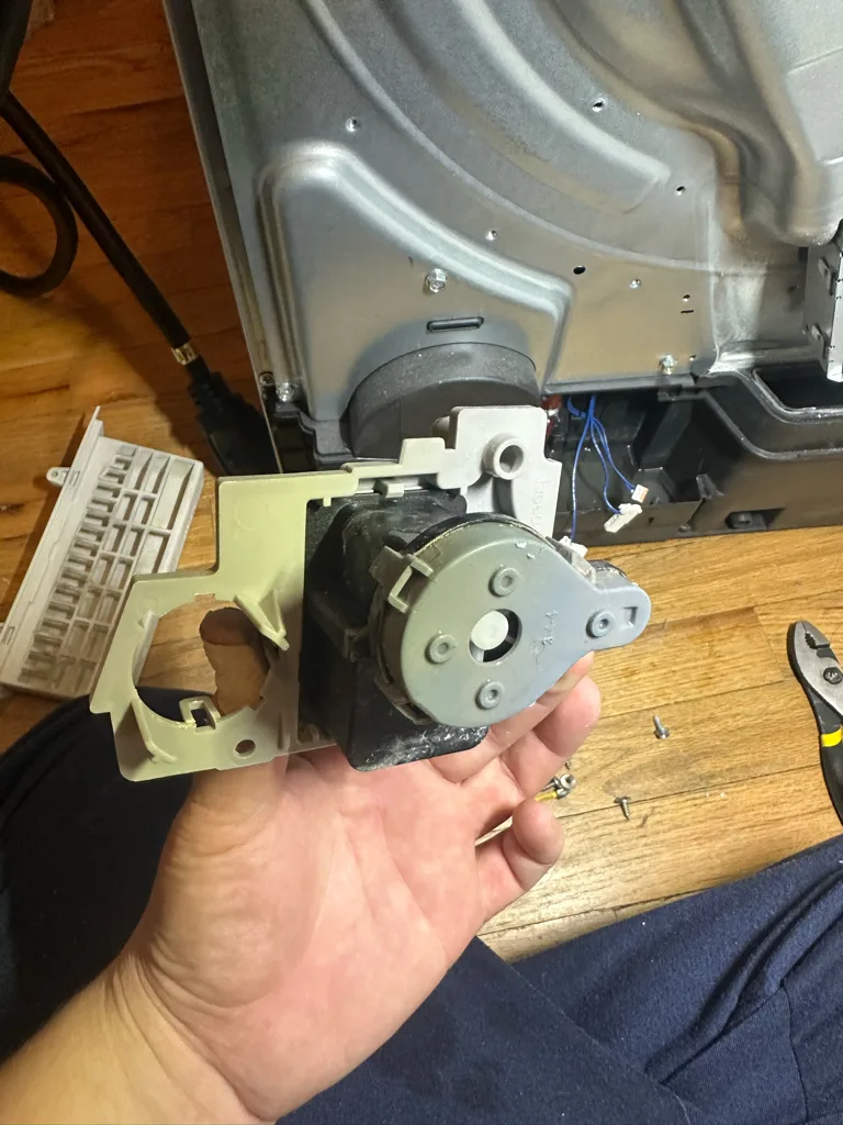 Drain pump removed from an Electrolux ventless condensing dryer