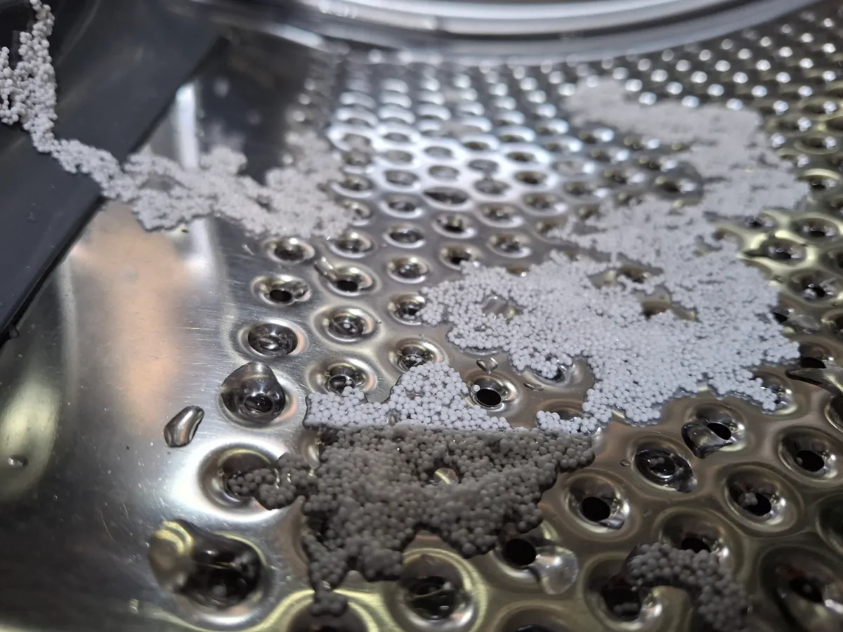 Debris stuck in the drum holes of an Electrolux washer