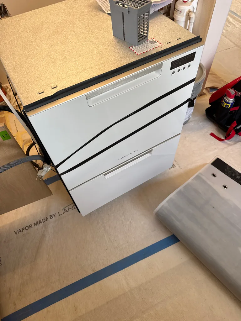 Fisher & Paykel DishDrawer pulled out of its cabinet for a motor repair