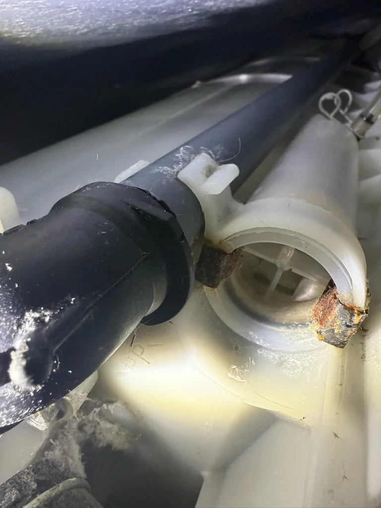 Recirculation pump hose inside a Fisher & Paykel washer