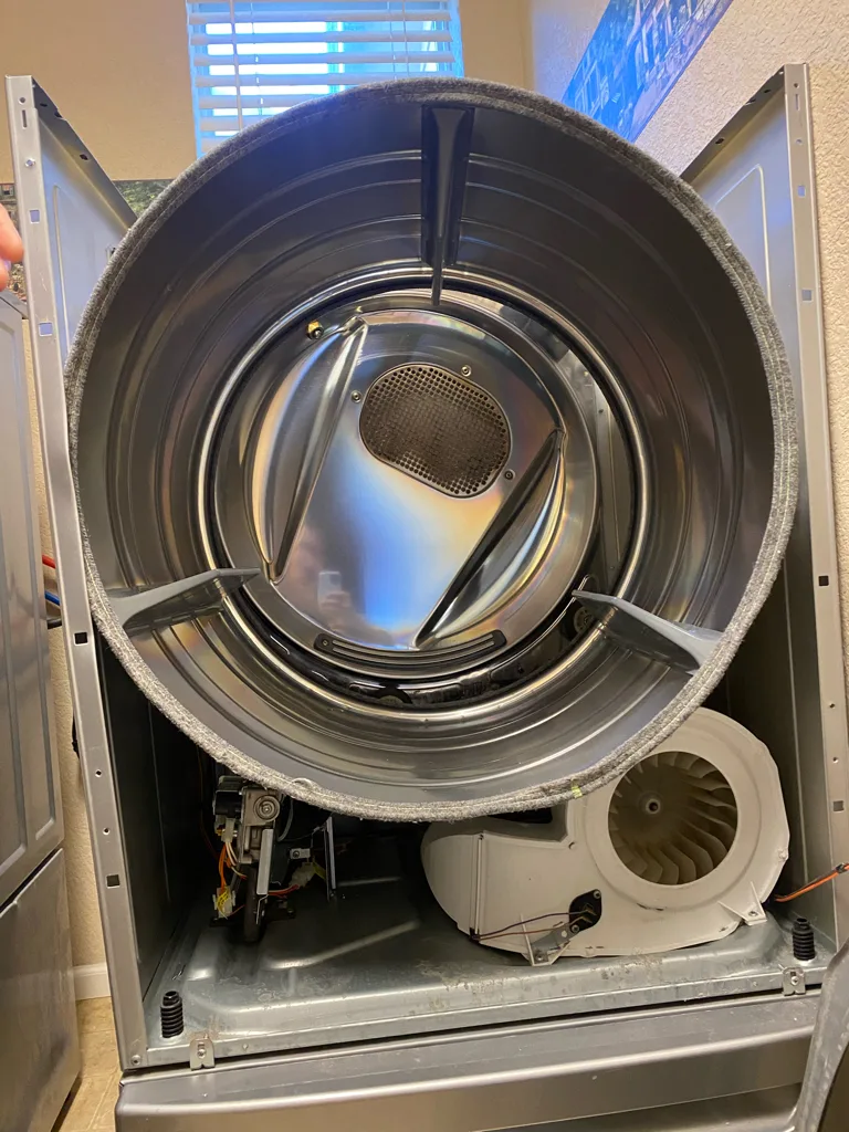 Frigidaire dryer with the front off during an E66 repair