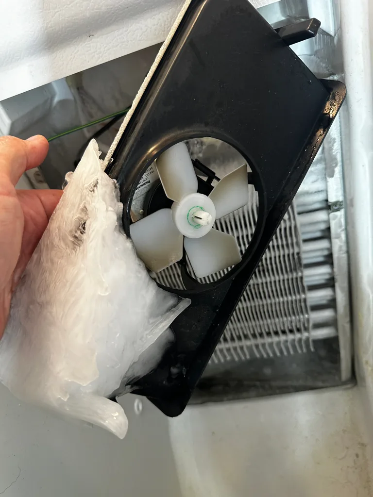 Evaporator fan encased in ice from a Frigidaire refrigerator