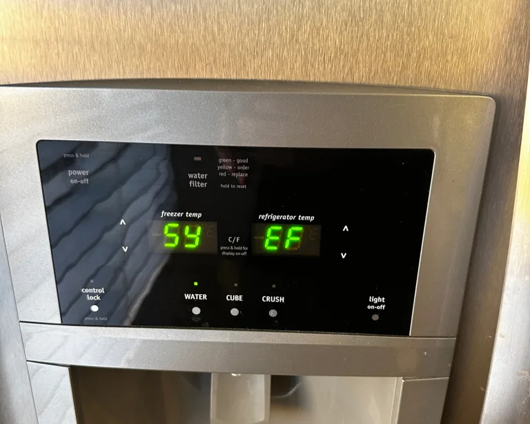 Frigidaire refrigerator dispenser display showing SY EF