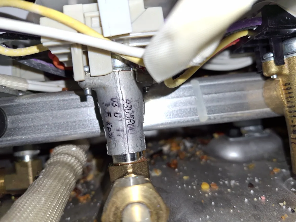 Gas valve area under a GE Profile cooktop