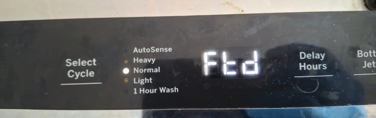 GE dishwasher control panel showing the Ftd failure-to-drain code