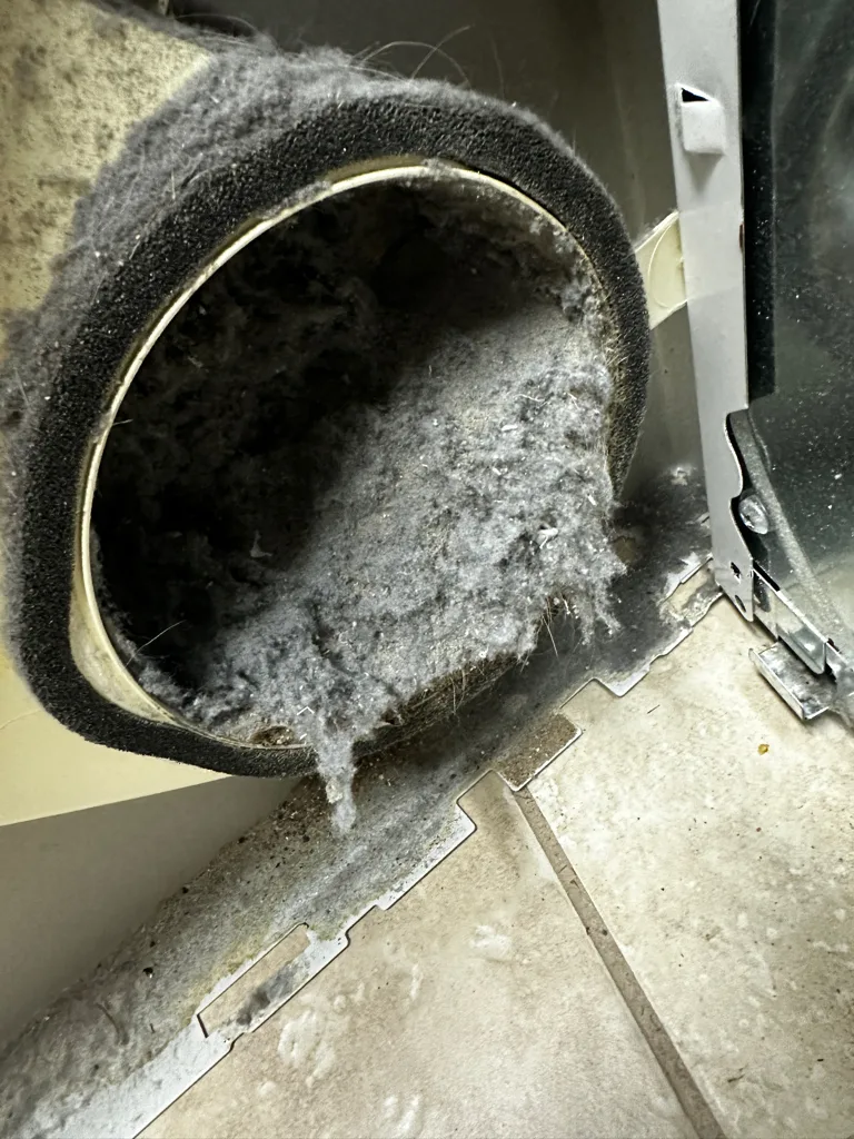 Lint packed in the blower housing of a GE dryer