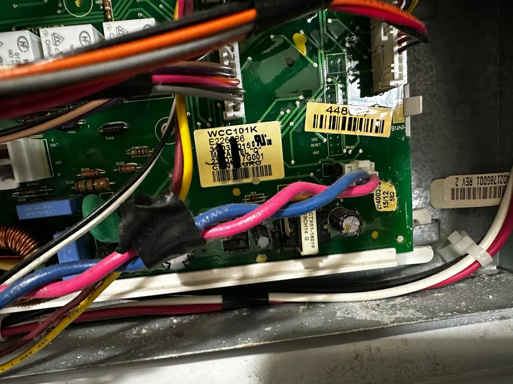 Control board and wiring inside a GE washer
