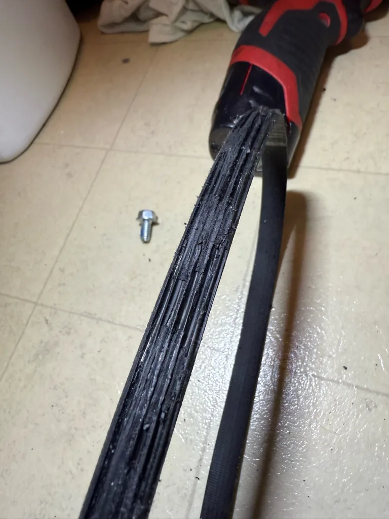 Worn drive belt removed from a GE washer
