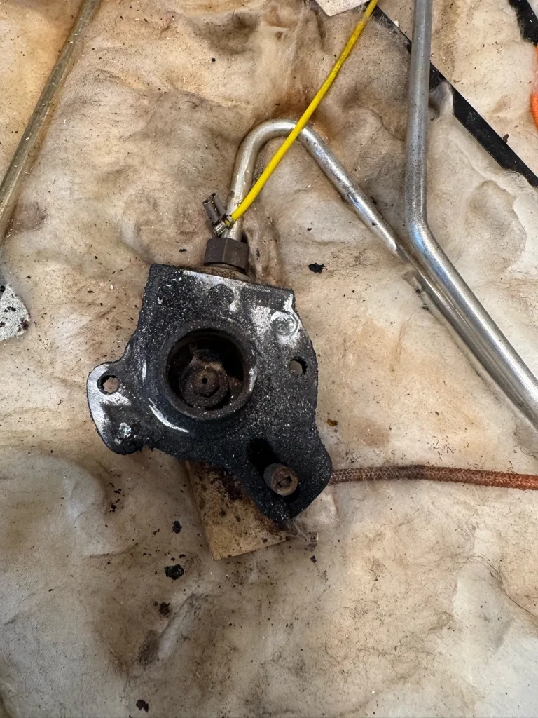 Burner part removed from a JennAir gas stovetop