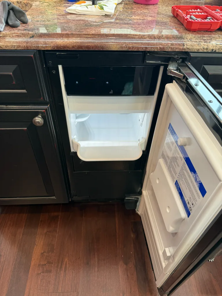 JennAir undercounter ice maker in a kitchen island