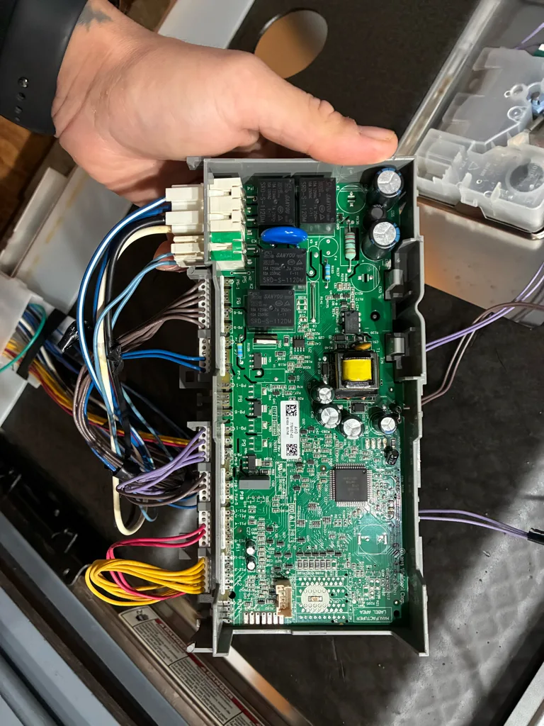 Main control board removed from a Kenmore dishwasher