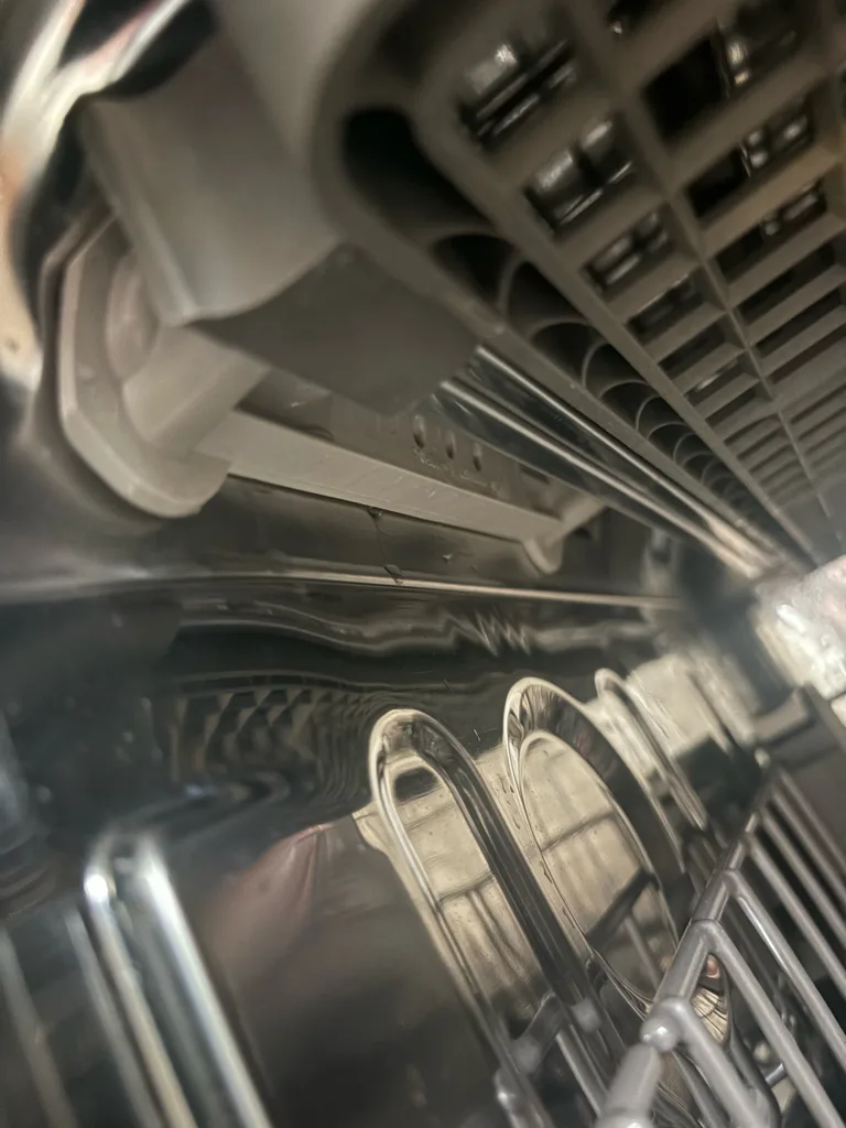 Broken rack side rail inside a Kenmore Elite dishwasher