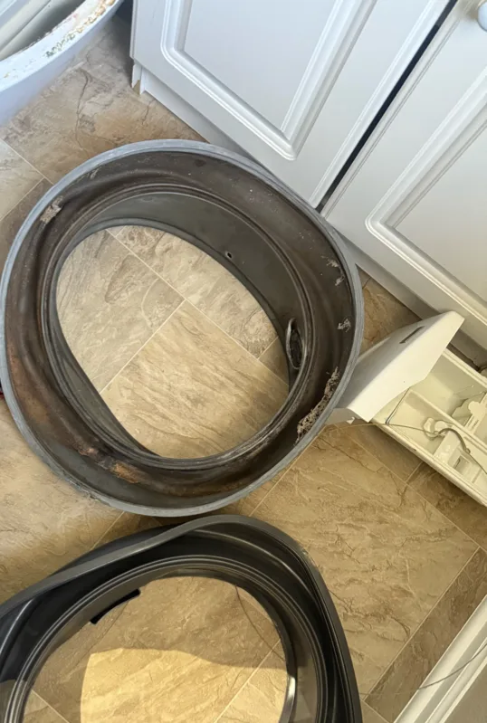 Old and new door boot seals for a Kenmore front-load washer