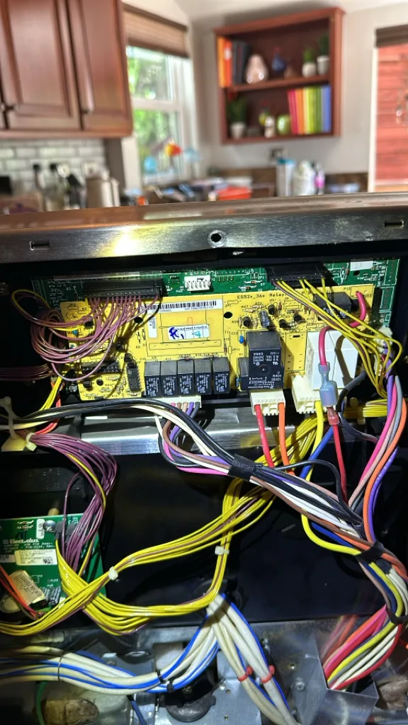 Control board and wiring inside a Kenmore induction range