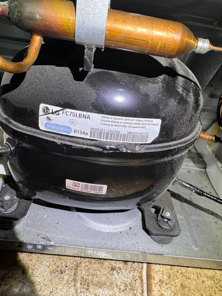 LG compressor inside a Kenmore refrigerator