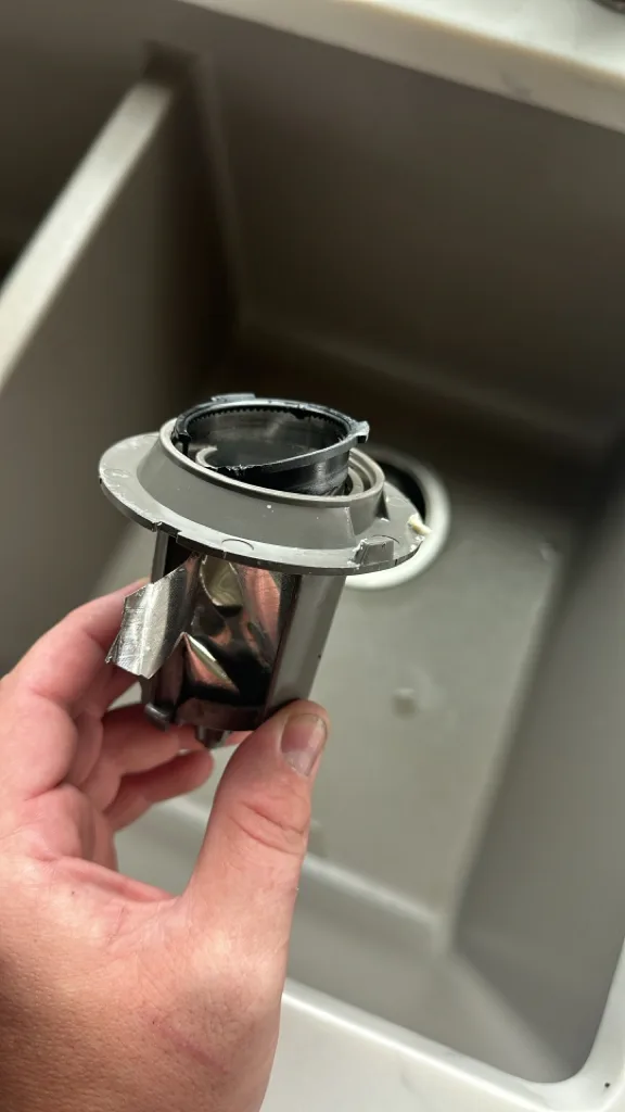 Cylindrical filter removed from a KitchenAid dishwasher