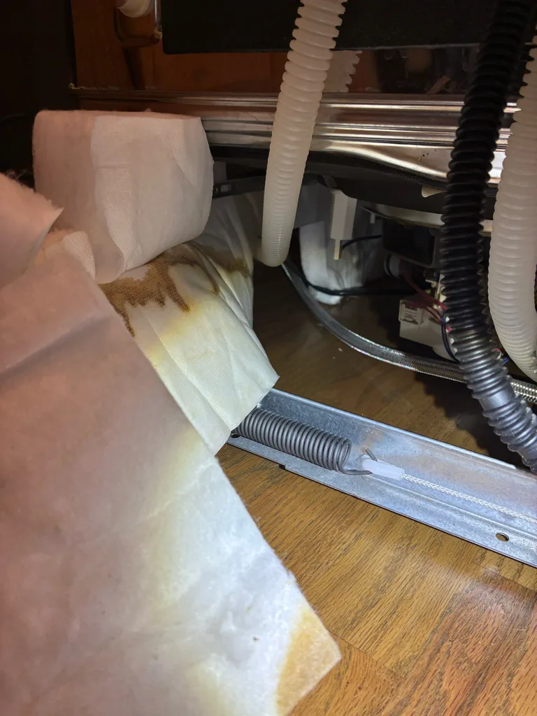 Water stains on towels under a leaking KitchenAid dishwasher