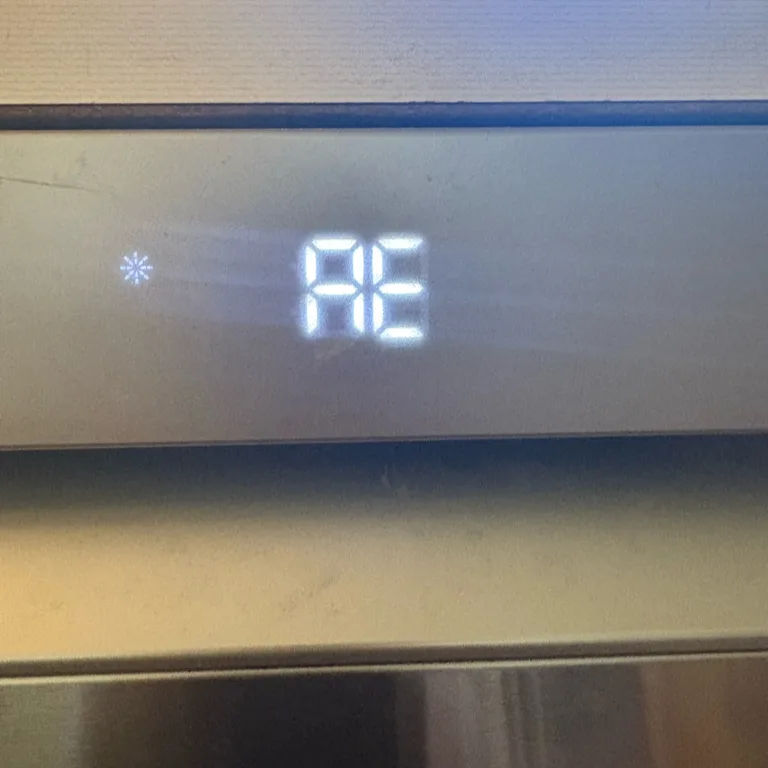 LG dishwasher display showing an AE error after water reached the base