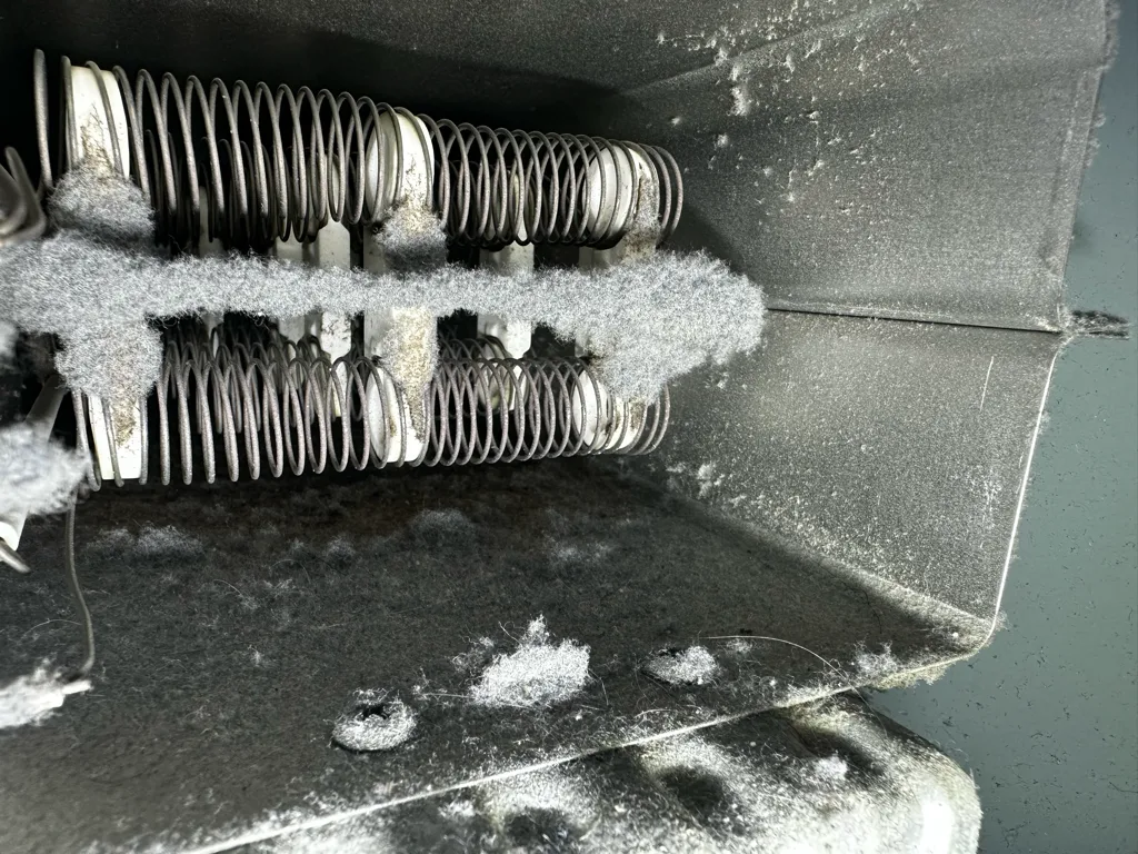 LG dryer heating element coils with lint built up