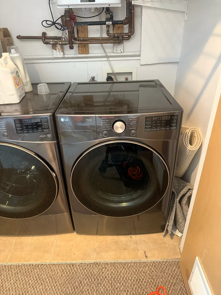 Graphite LG front-load washer and dryer pair in a Denver-area laundry room