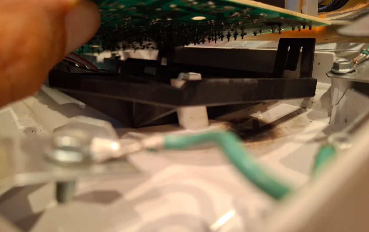 Control board being removed from a Maytag dishwasher