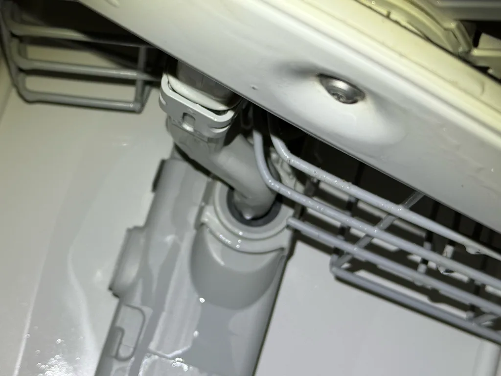 Spray manifold and wash arm inside a Maytag dishwasher