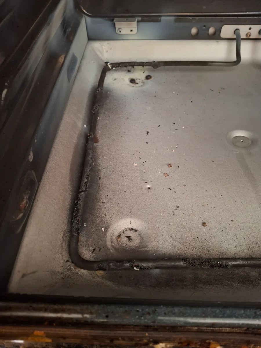 Burned bake element inside a Maytag electric oven that sparked