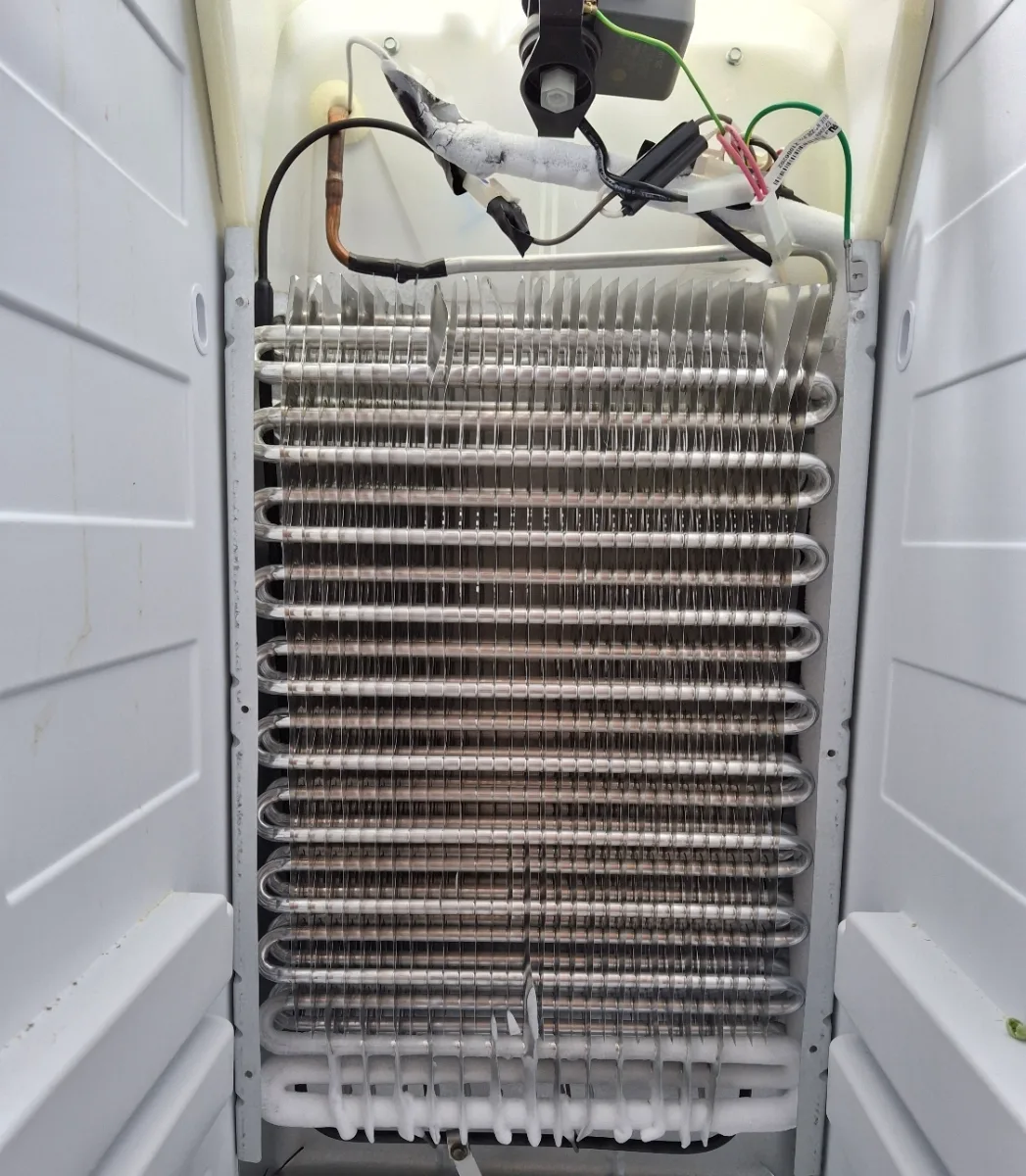 Evaporator coil exposed in a Maytag bottom-freezer refrigerator