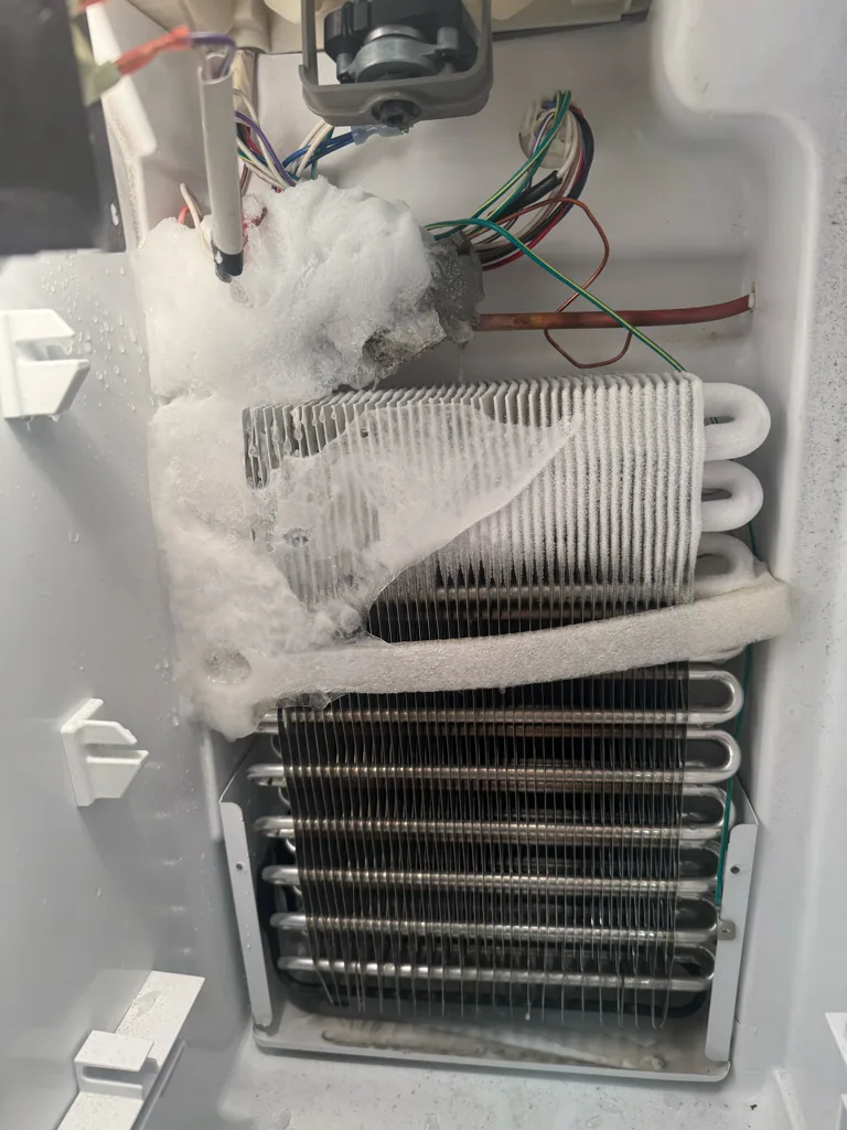Maytag freezer evaporator coil covered in frost from a defrost problem