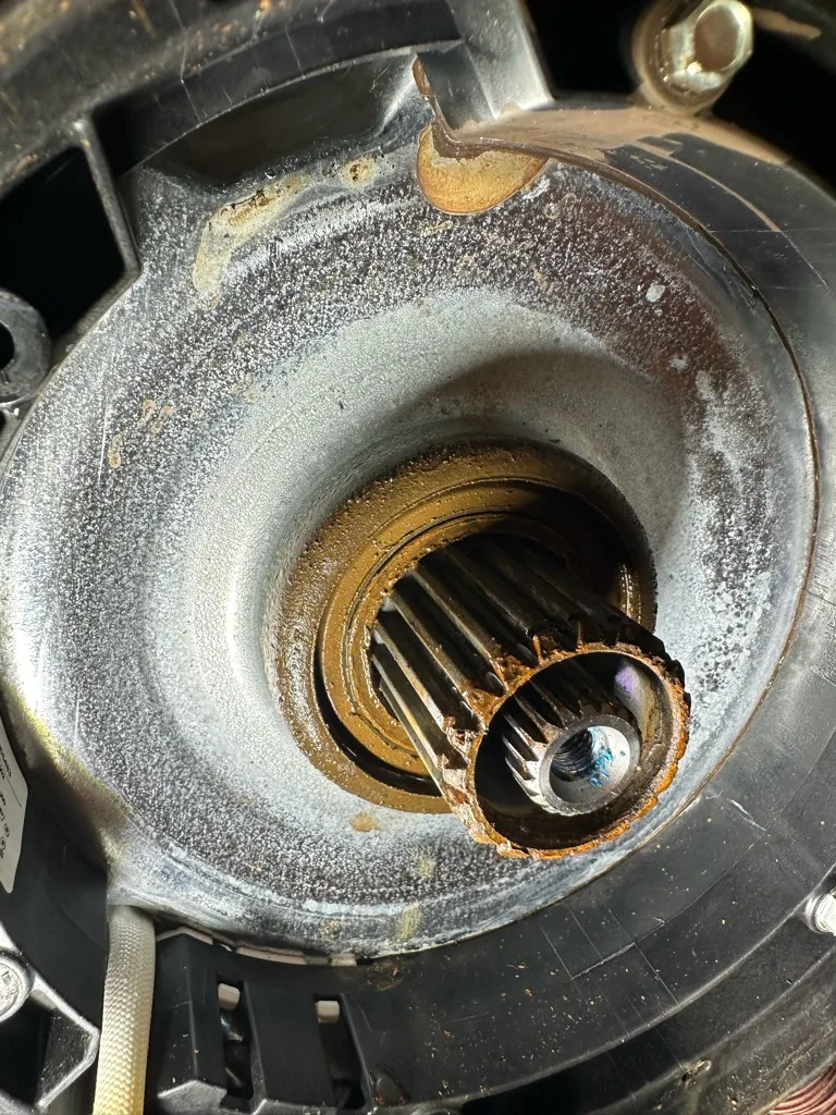 Corroded drive hub and shaft under the basket of a Maytag top-load washer