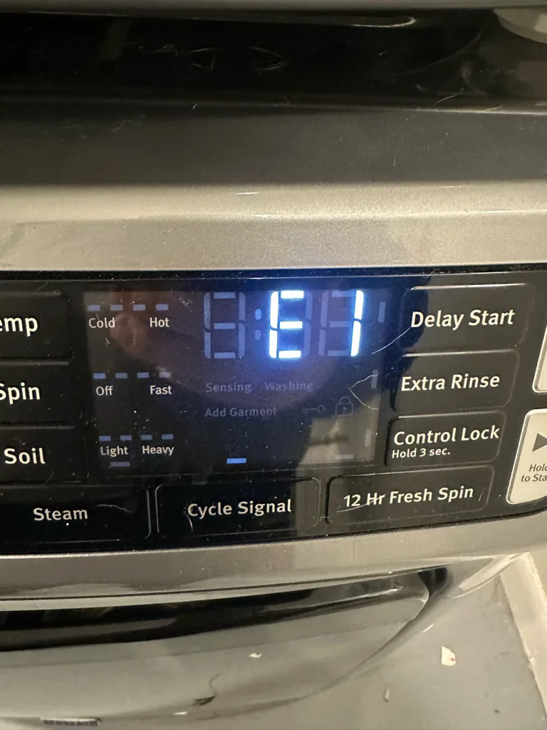 Maytag front-load washer display showing E1