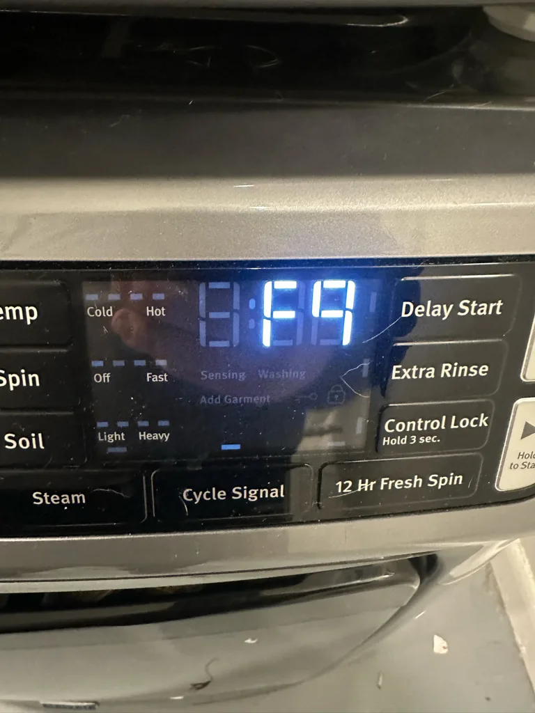 Maytag front-load washer display showing F9