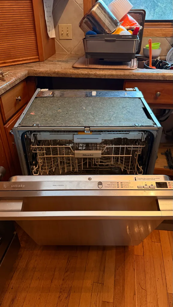 Miele dishwasher pulled forward during an F14 repair