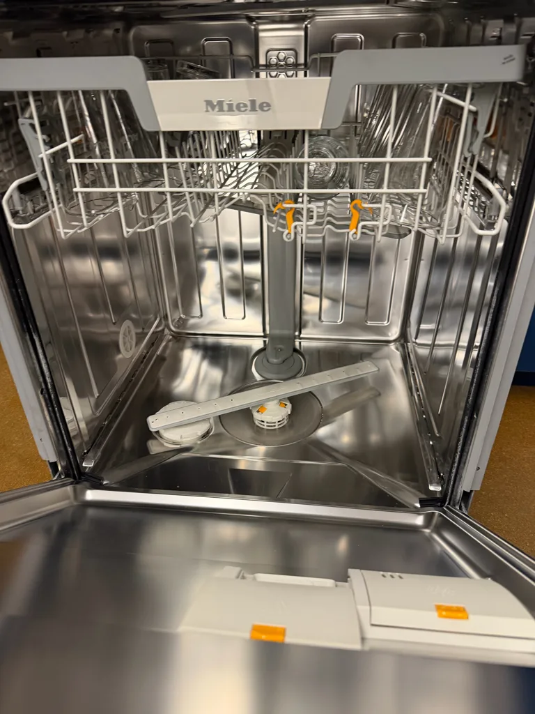 Inside a Miele dishwasher with the racks out