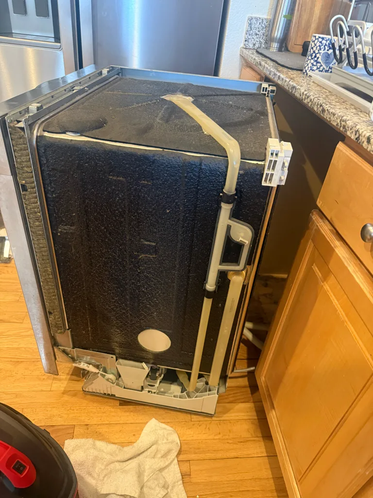 Miele dishwasher pulled out of its cabinet for service