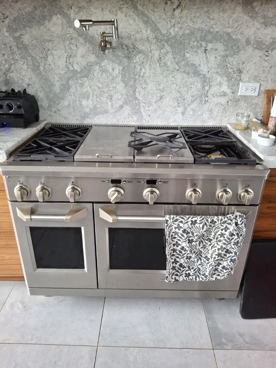 Monogram professional dual-fuel range with a griddle in a Denver-area kitchen