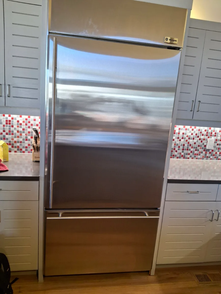 Monogram built-in bottom-freezer refrigerator in a Denver-area kitchen