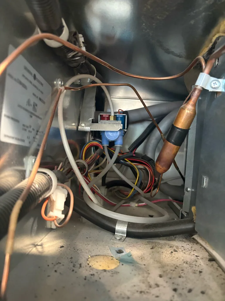 Water line and valve under a Monogram refrigerator