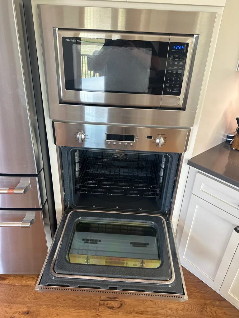 Monogram wall oven and speed-cook oven with the lower door open