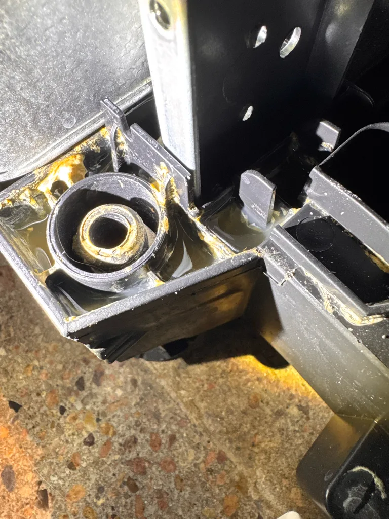 Base pan and leak sensor area of a Samsung dishwasher with an LC leak code