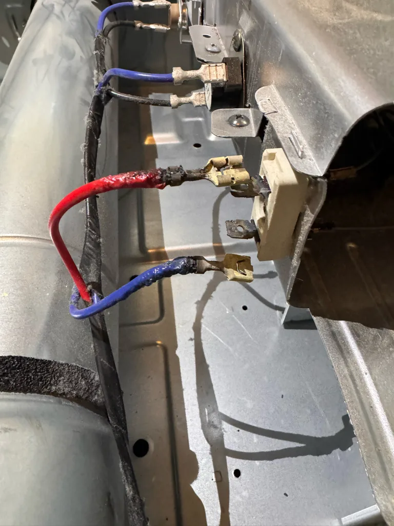 Heating element terminals and wire harness on a Samsung electric dryer